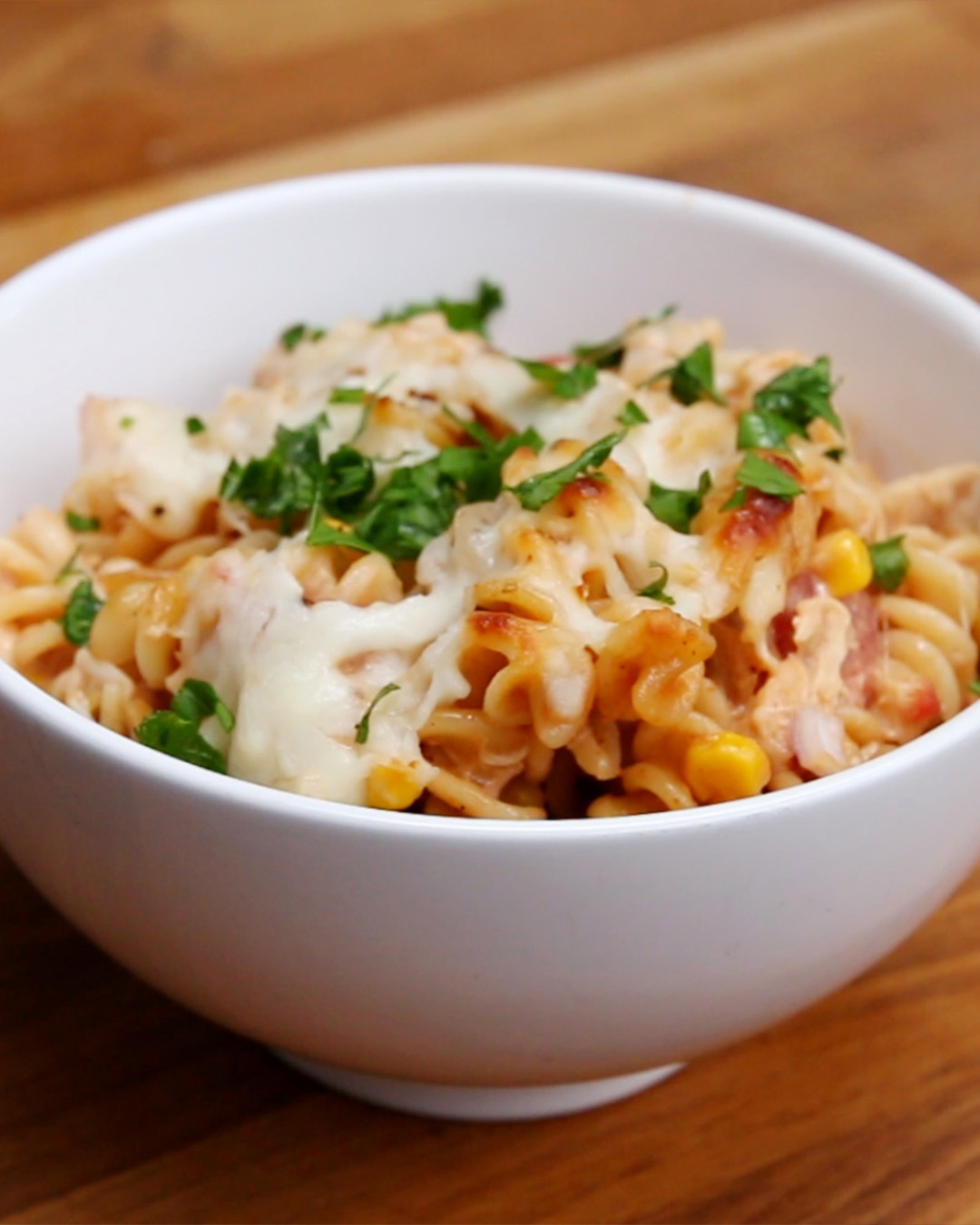 Bowl of pasta with melted cheese on top